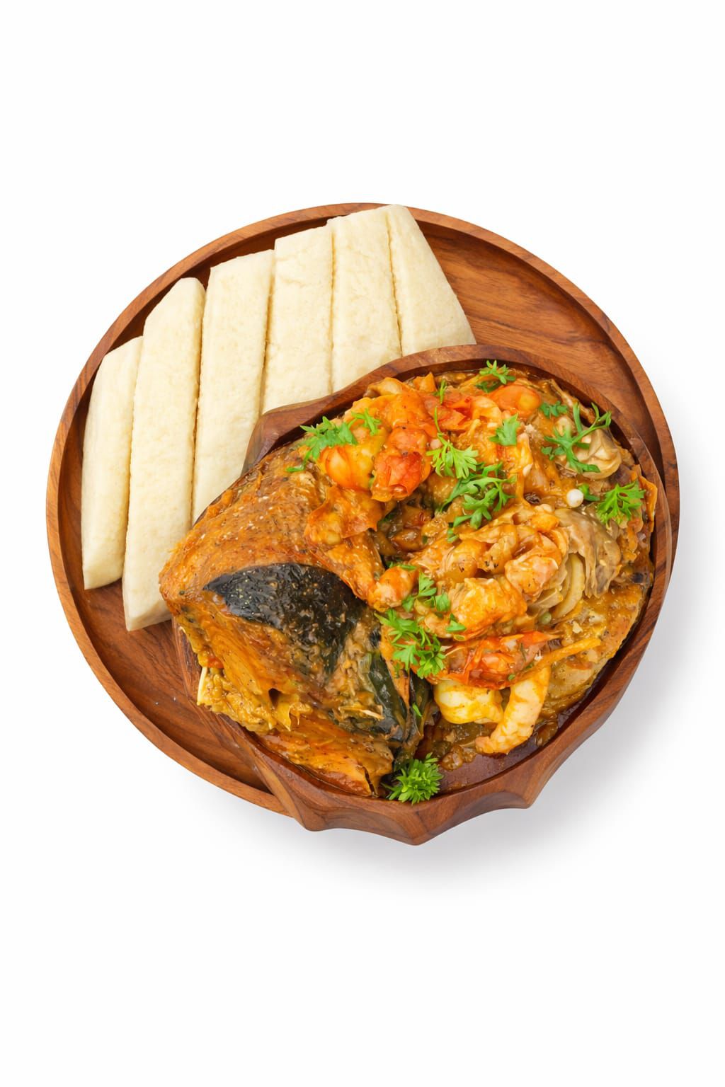 Seafood soup with swallow on a wooden plate